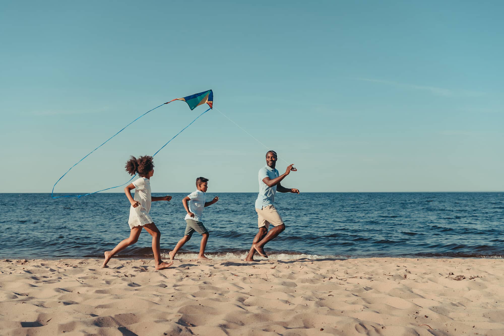 flying a kite with family happy.jpg