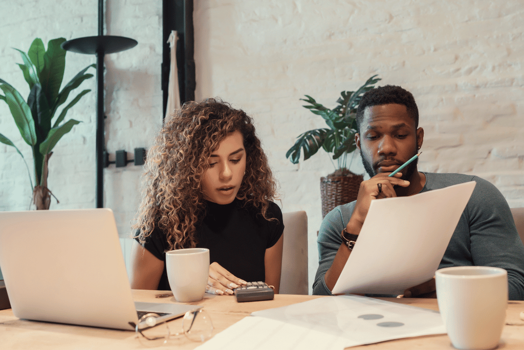 couple working on their finances together and improving their future