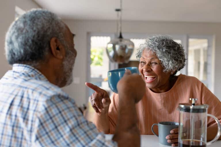 senior couple happy after reverse mortgage counseling